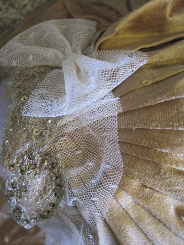 A metallic bronze leather circle skirt a grey herring bone corset